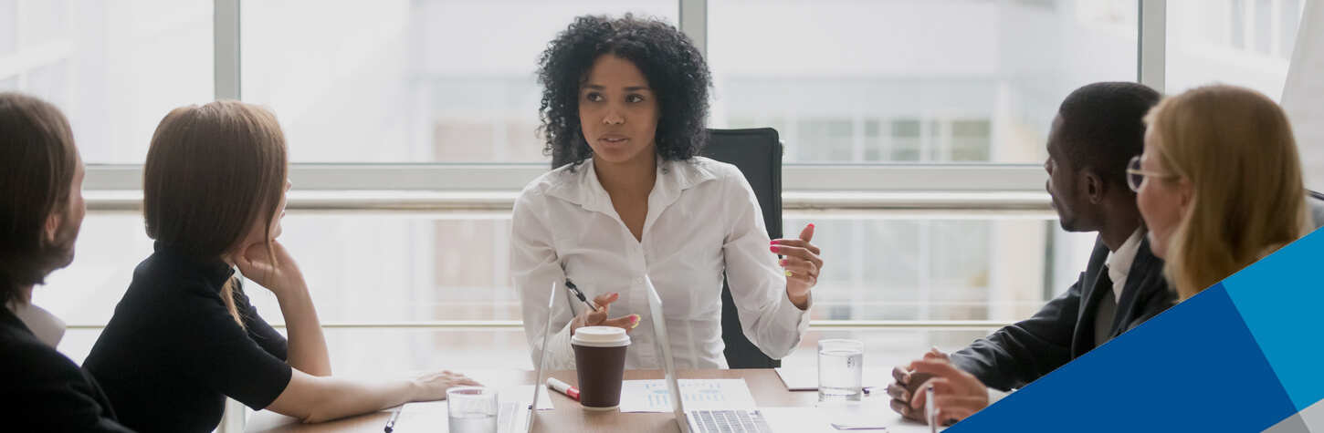 businesswoman in a meeting with her team