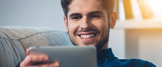 man looking at tablet