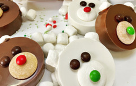 Hot chocolate bombs decorated like polar bears.