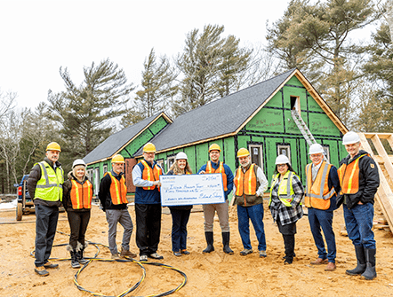 Members of the Island Housing Trust posing with their giant check from Rockland Trust's Charitable Foundation.